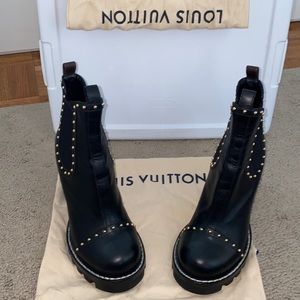 Black studded Louis Vuitton boots